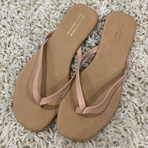 Nude leather flip flops